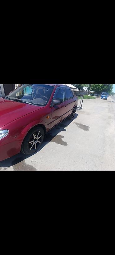обмен на квартиры: Mazda 323: 2001 г., 1.8 л, Автомат, Бензин, Седан — 5