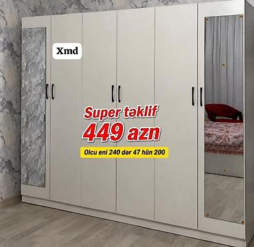 Ağ rəngdə, çox bölməli paltar dolabı. - Ön hissədə 5 qapı, iki