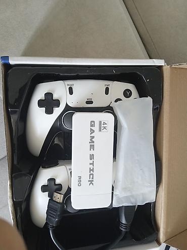 game stic: Игровая приставка Game Stick Pro 4K Комплект: - ТВ-стик Game Stick — 1