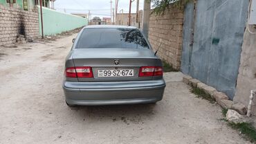 Iran Khodro: Samand sedan – benzinli, ön ötürücülü. Gümüşü rəng.nömrə nişanı — 10