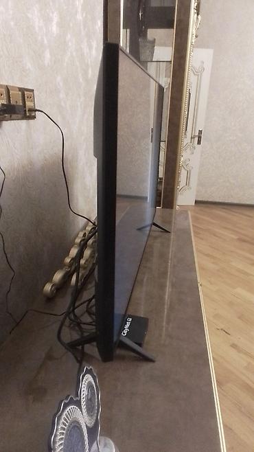 televizor ekran qoruyucu: Smart TV – təxminən 43–50 düym, nazik çərçivəli və incə korpuslu — 2