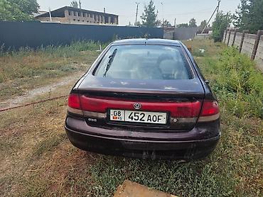 ручка бмв: Mazda 626: 1994 г., 1.8 л, Механика, Бензин, Седан — 3