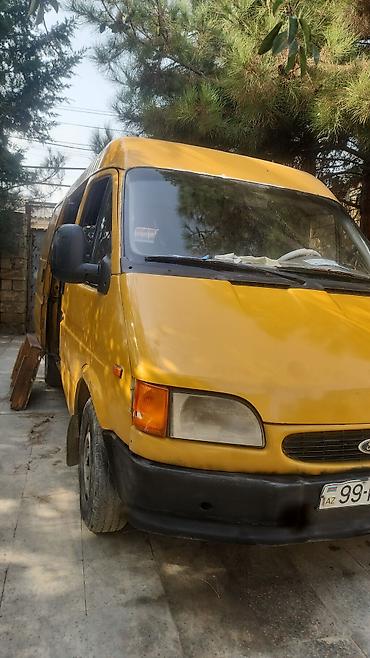 Ford: Ford Transit sarı rəngli yük/miniven. Xüsusiyyətlər: - Kuzov tipi — 2