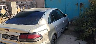 китайский номер: Mazda 626: 1999 г., Бензин, Седан — 1