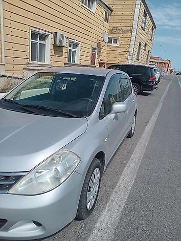 07 satşı: Nissan Tiida, gümüşü rəng, hatchback kuzov. Əsas xüsusiyyətlər: - — 2