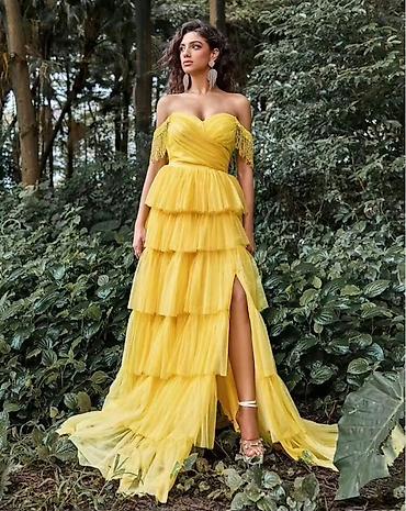 Haljine: Elegantna večernja haljina u jarko žutoj boji. Model je bez naramenica — 1