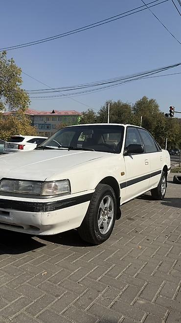 автомобильное зу: Mazda 626: 1990 г., 2 л, Механика, Бензин, Седан — 4