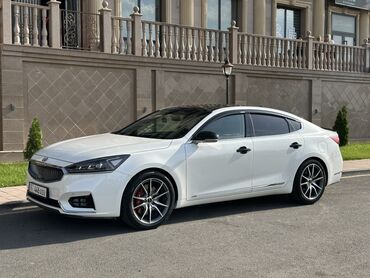 выхлоп remus: Белый седан Kia К7 с черной крышей. Автомобиль оснащен легкосплавными