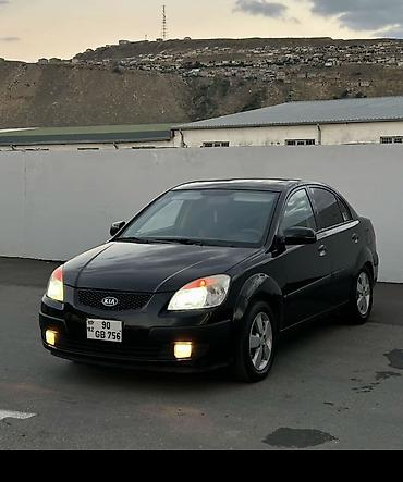 masin 099: Kia Rio: 1.4 l | 2008 il Sedan — 2