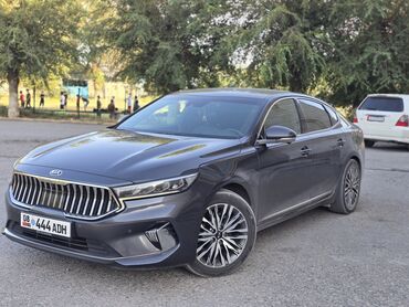 аренда авто последующим выкупом: Элегантный седан Kia K7 тёмно-серого цвета, отличающийся современным