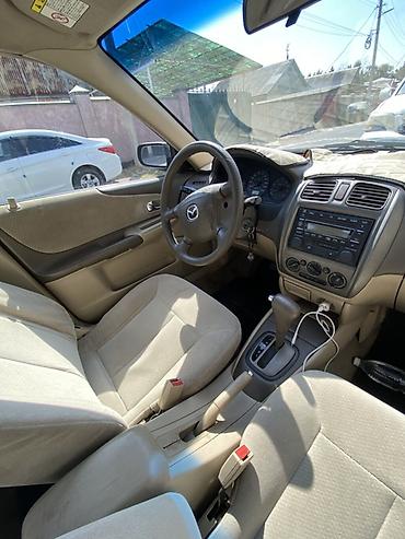 mazda 2004: Mazda 323: 2003 г., Автомат, Бензин, Седан — 9