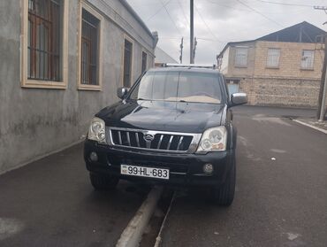 запчасти гольф 2: Qara rəngdə SUV tipli avtomobil. Bu model dörd qapılı dizaynı və geniş