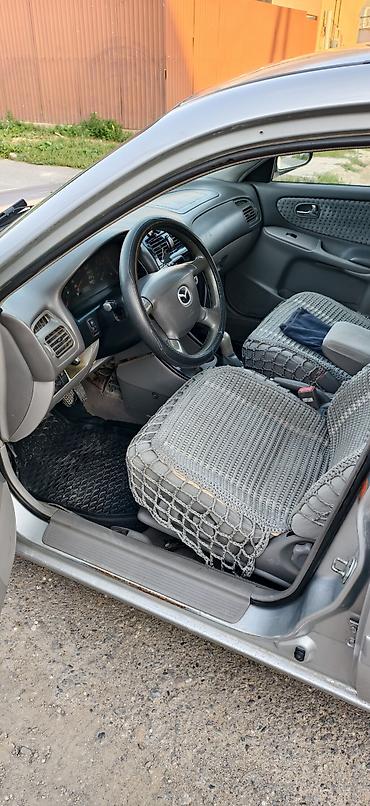 чехол на мопед: Mazda 626: 2000 г., 2 л, Механика, Бензин, Хэтчбэк — 6
