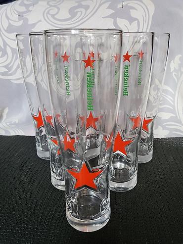 Čaše: Case nove za pivo Heineken. Case nove,sve na njima odsjaj od svetla — 9