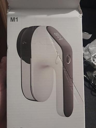 Ostali kućni aparati: Električni aparat za uklanjanje mucica i dlačica sa odeće (lint — 11