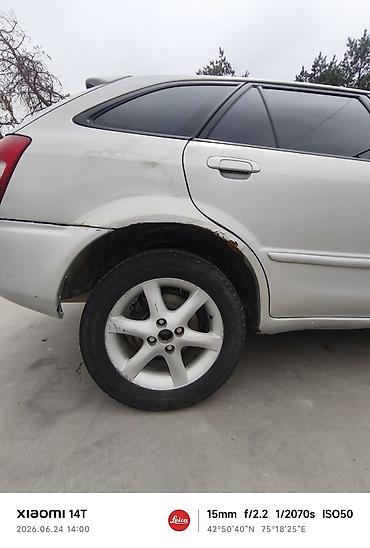 e53 amg: Mazda Familia: 2001 г., Универсал — 4