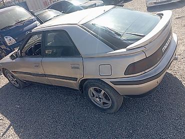 бампер сди: Mazda 323: 1990 г., Механика, Седан — 4