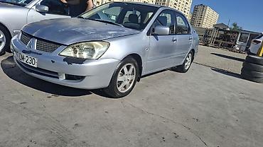 duman fara: Mitsubishi Lancer: 1.6 l | 2006 il 466000 km Sedan — 6
