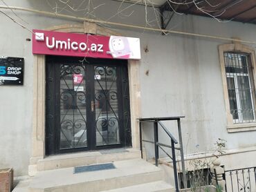 тап аз недвижимость: Bu şəkil Umico.az və Drop Shop mağazalarının cəbhəsini göstərir