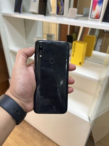 рюкзаки из кожзаменителя: Xiaomi Redmi 7, 32 ГБ, цвет - Черный, 
 Отпечаток пальца, Face ID