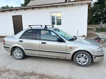 Mazda: Mazda 323: 1998 г., 1.6 л, Механика, Бензин, Седан