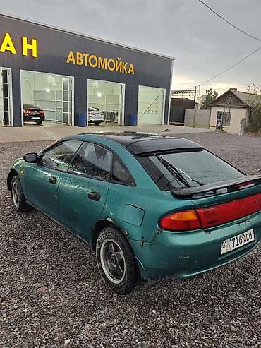 Унаа сатуу: Mazda 323: 1996 г., 1.5 л, Кол менен иштөөчү, Бензин, Хетчбек — 5