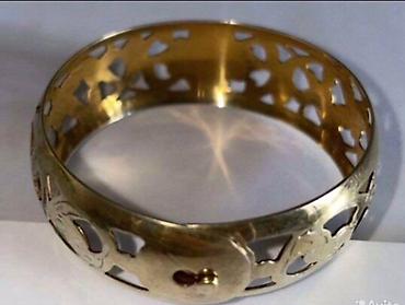 Серебряные браслеты: Серебряный браслет с позолотой с ажурным орнаментом. В центре браслета — 2