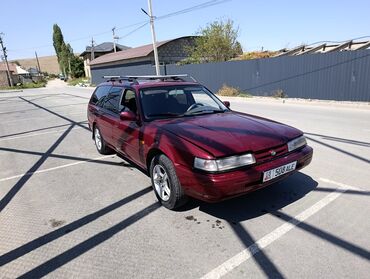мазда вонга: Универсал Mazda 626, окрашенный в темно-красный цвет, предлагает
