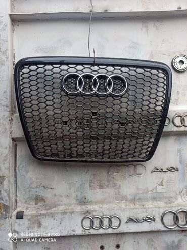Щитки приборов: Решетка радиатора Audi