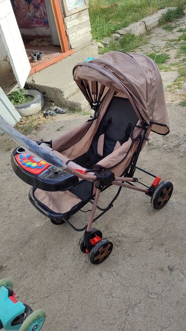 детские коляски российского производства: Коляска, цвет - Коричневый, Новый