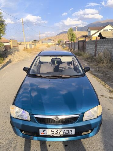 машина женская: Mazda 323: 1999 г., 1.5 л, Механика, Бензин, Хэтчбэк