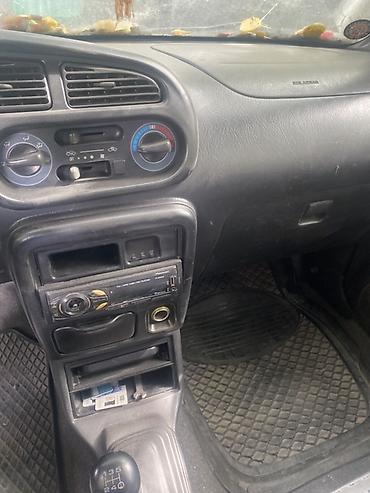 машина берем: Daihatsu Cuore: 2002 г., 1 л, Механика, Бензин, Хэтчбэк — 7