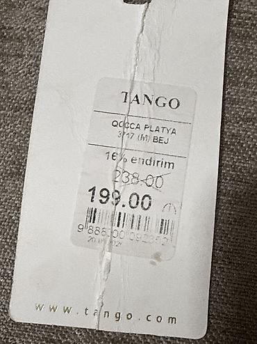 qisa donlar: Xanımlara xüsusi zəriflik qatan ağ rəngdə, qara xallı mini don. - — 3