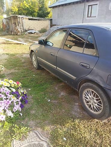 sprinter 516: Mazda 626: 1999 г., 1.8 л, Механика, Газ, Седан — 4