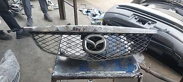 Решетки радиатора: Решетка радиатора Mazda Оригинал — 7