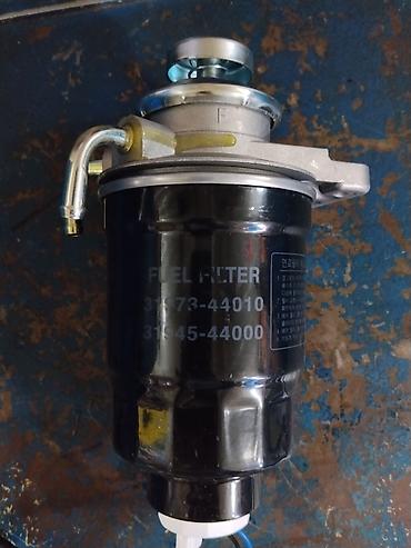 Фильтры: Топливный фильтр в сборе (Fuel Filter) - Номер(а) по корпусу: 310 / — 2