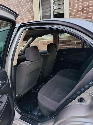 Nissan: Nissan Sunny: 1.3 l | 2005 il Sedan — 10