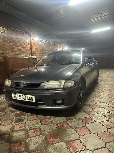 фамиля: Mazda Familia: 1997 г., 1.6 л, Автомат, Бензин, Седан — 1