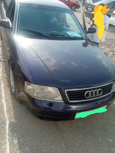 жугли 01: Автомобиль Audi A6 в кузове седан. Этот автомобиль темно-синего цвета