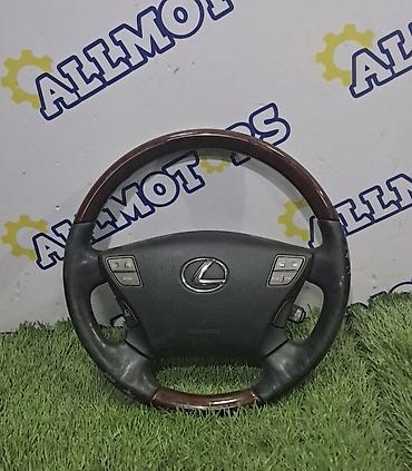 Рулевое колесо Lexus с деревянными вставками и кожаной оплёткой