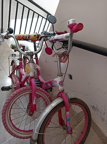 velo disk: Uşaq velosipedi, çəhrayı rəngdə və Winx Magic dizaynlıdır. Velosipedin — 2