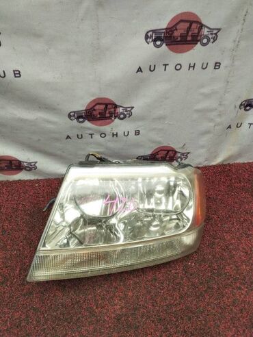 Другие автозапчасти: Фара Jeep Cherokee WJ40 4000 2001 лев. (б/у) КУЗОВНЫЕ ДЕТАЛИ - #капот