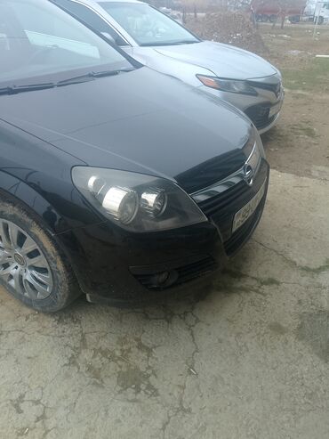 xezer avtomobil qiymetleri: Opel Astra: 1.4 l | 2004 il 100 km