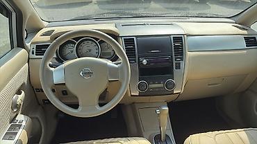 bort baqaj: Nissan Tiida hatchback – gümüşü rəng Xüsusiyyətlər və təchizat: - — 8