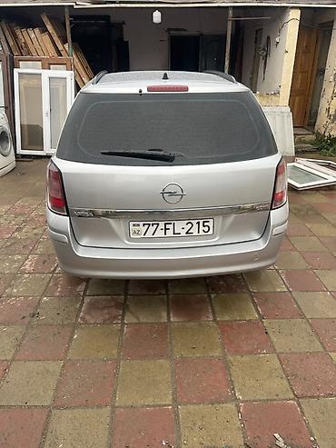 lada kalina 2008: Opel Astra Caravan (universall) – gümüşü rəng Xüsusiyyətlər: - Kuzov — 3