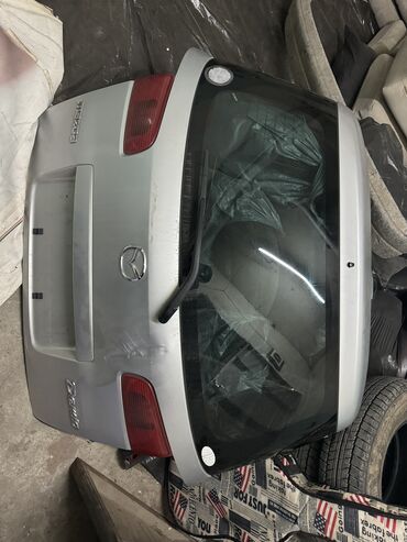 удаление вмятин на авто: Крышка багажника Mazda 2003 г., Б/у, цвет - Серебристый,Оригинал