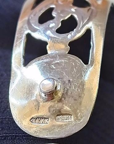 Серебряные браслеты: Серебряный браслет с позолотой с ажурным орнаментом. В центре браслета — 10