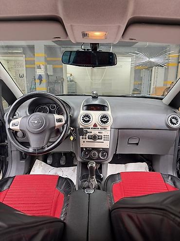 bot kar: Opel Corsa D, hetçbek kuzov, 5 qapı, qara rəng. Əsas xüsusiyyətlər: - — 8