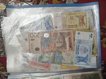 Монеты: Коллекция монет и банкнот России Состав: - Альбом «Памятные монеты — 21