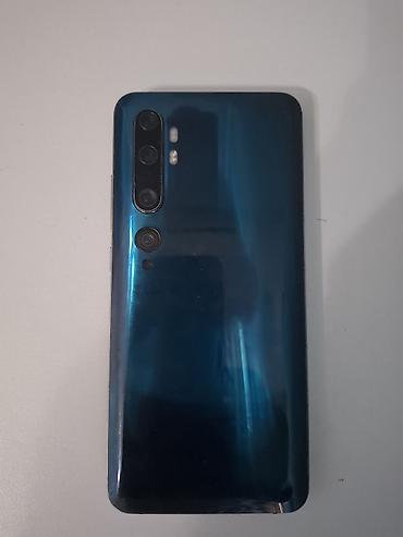 note 50 pro: Mavi rəngdə, böyük ekranlı smartfon. Cihazın ön hissəsində damla — 2